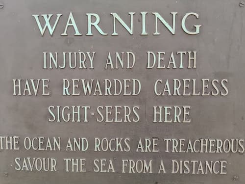 Warning sign posted at Peggy`s Cove for foolish tourists